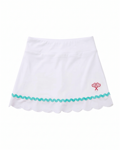 A white A-line skirt with a scalloped hem, a turquoise wavy trim line, and a small red embroidered hearts motif on the right side, shown against a plain white background.