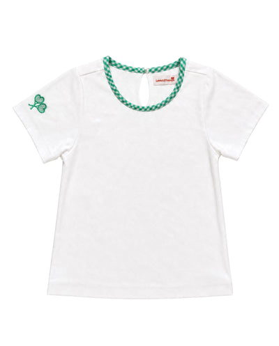 A white short-sleeve baby tee with a green and white checkered trim around the crew neck and a green shamrock on the left sleeve, shown on a plain white background.